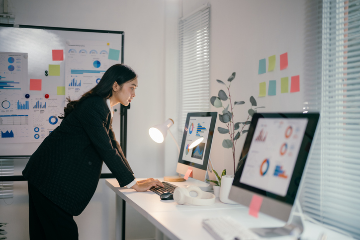 Nonprofit executive reviewing leadership and organizational data to navigate the 2025 funding crisis